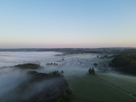 Morning fog over the cottage Remlinggrade in Radevormwald, Germanyの写真素材