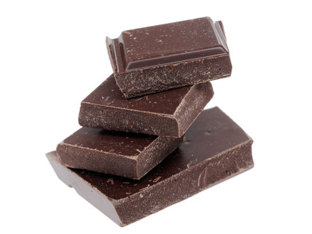 dark chocolate pieces on white backgroundの写真素材