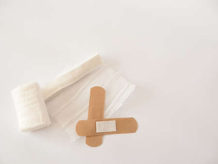 Adhesive plaster and gauze dressing. White backgroundの写真素材