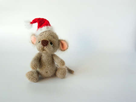 soft toy little mouse in a Christmas hat.の写真素材