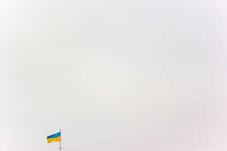 Flag of Ukraine on a background of gray skyの写真素材