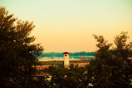 Beautiful sunset and lighthouse by the river