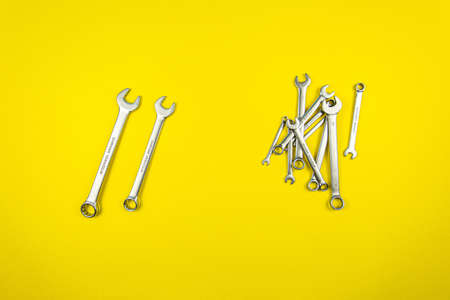 Set of wrenches of different sizes on a yellow backgroundの写真素材