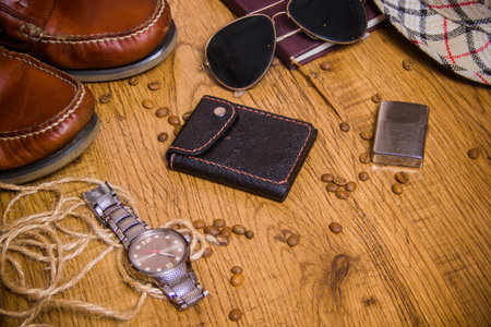 Set of gentleman's watches, glasses, wallet, boots, bank cards, lighter