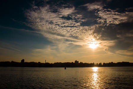 Incredible sunset over the river with cloudsの写真素材