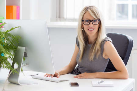 Portrait of young successful businesswoman in the office  の写真素材