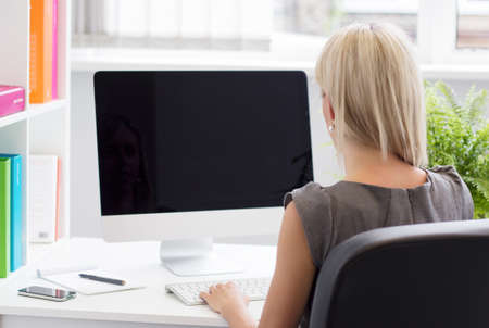 Young professional woman working in the office  の写真素材
