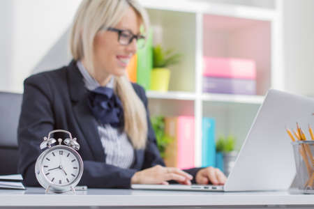 Hard working woman is always on time at work Hard working woman is always on time at work