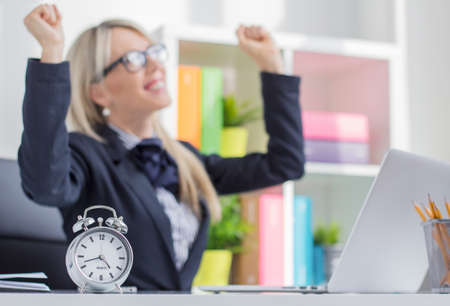 Happy young woman enjoy finishing job on timeの写真素材