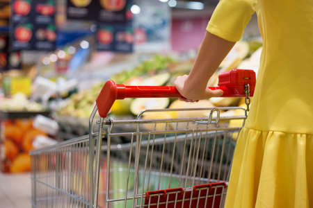 Woman shopping for groceries in supermarketの写真素材