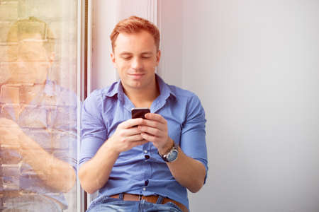 Young man using smartphoneの写真素材