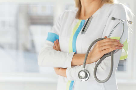 Female doctor holding stethoscopeの写真素材