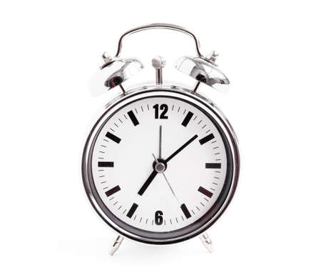 Shiny silver alarm clock isolated on white backgroundの写真素材