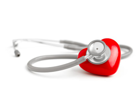 Stethoscope and red heart isolated on white background