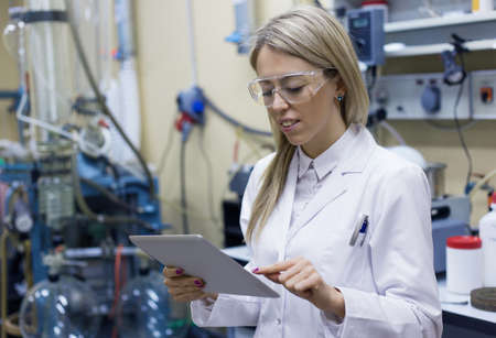 Female scientist using tablet computer in the labの写真素材
