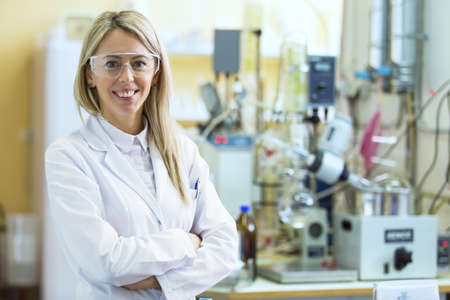 Smiling young chemist in chemistry labの写真素材
