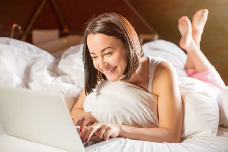 Hard working even at morning in bed is key for successの写真素材