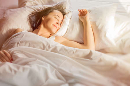 Woman sleeping in bedの写真素材
