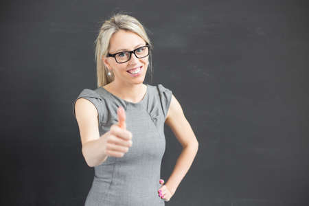 Teacher showing thumb upの写真素材