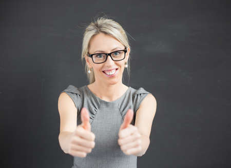 Woman showing thumbs upの写真素材