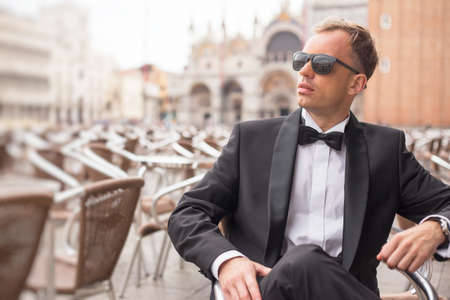 Portrait of handsome confident man in tuxedoの写真素材