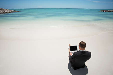 Businessman on the beachの写真素材