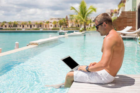 Blogger using laptop computerの写真素材