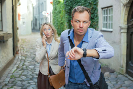 Man looking at his watchの写真素材