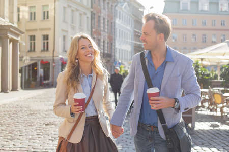 Man and woman holding handsの写真素材