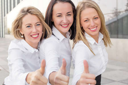 Business woman with thumbs upの写真素材