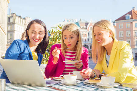 Three friends looking at computerの写真素材