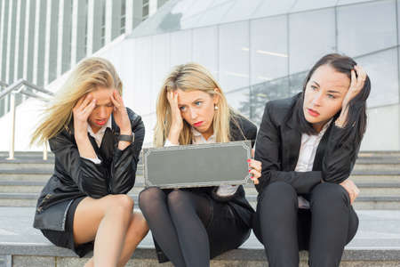 Three depressed corporate business womenの写真素材