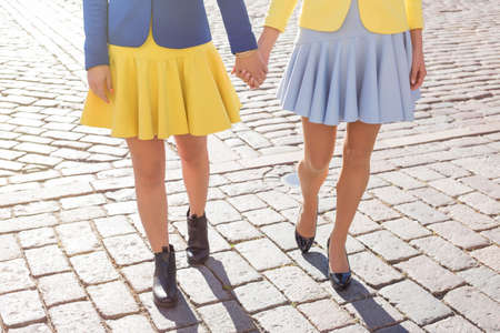 Two girlfriends walkingの写真素材