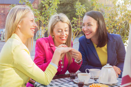 Woman showing  friends her ringの写真素材