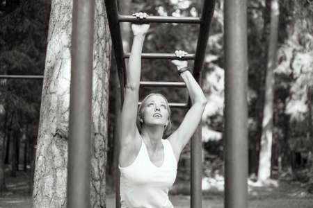 Athletic woman using arm strengthの写真素材