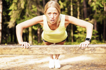 Woman doing pushupsの写真素材