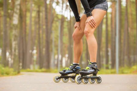 Fit woman or roller skates restingの写真素材
