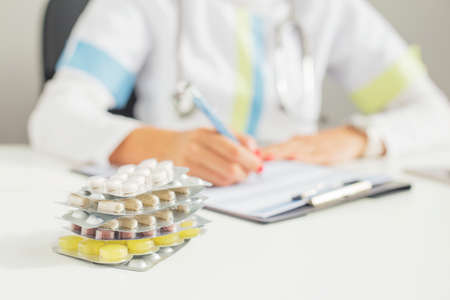 Doctor prescribing pillsの写真素材