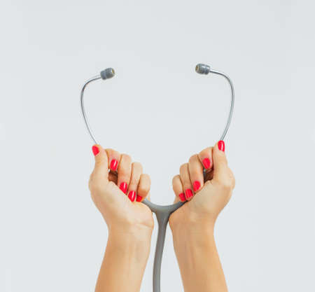 Doctor holding stethoscopeの写真素材