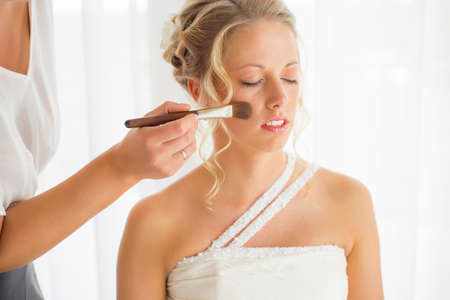Bride getting her makeup fixedの写真素材