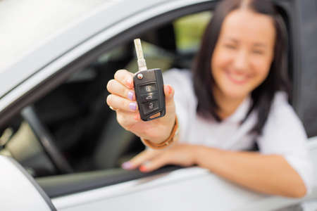 Woman showing car keysの写真素材