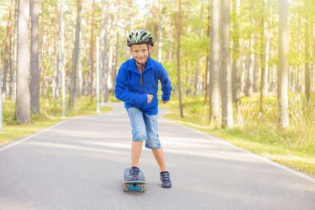 Little boy on skate boardの写真素材