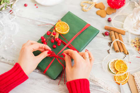 Woman wrapping giftの写真素材