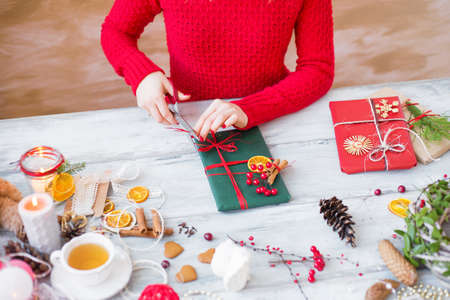 Woman wrapping giftの写真素材