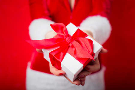 Woman holding Christmas giftの写真素材