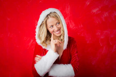 Naughty woman in red Santa costumeの写真素材
