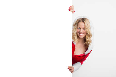 Woman in Christmas costume holding white backgroundの写真素材