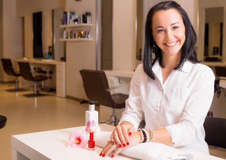 Happy woman after visiting manicureの写真素材
