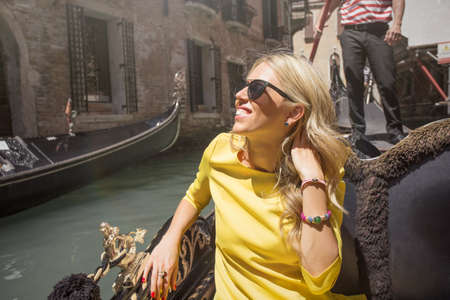 Happy woman in boatの写真素材