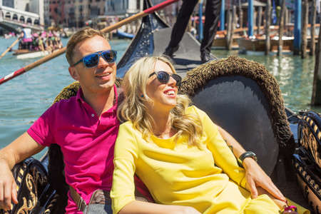 Woman leaning against man in little boatの写真素材